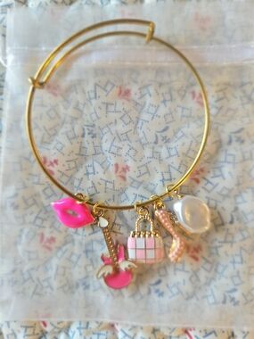 Gold-Tone Pink Charm Bangle Bracelet with Lip, Guitar, Bag & Pearl Charms